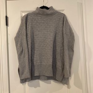 Novelty stitch sweater with funnel neck and split side hem